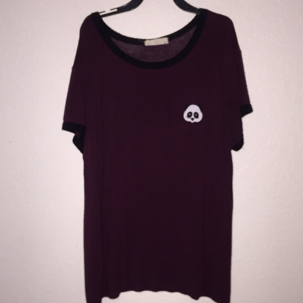 a purple t-shirt with a panda on it